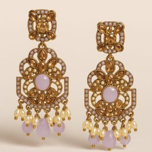 "GlowingFusions gold-plated statement earrings with lavender stones, pearl beads, and intricate Kundan-style detailing for festive and wedding wear."