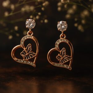 Elegant heart-shaped butterfly earrings with crystal stones – GlowingFusions affordable jewelry Title: Heart Butterfly Crystal Earrings – Stylish Affordable Jewelry by GlowingFusions Description: Romantic heart-shaped earrings with butterfly detailing, crystal embellishments, and a sparkling stud top. A graceful and affordable jewelry design from GlowingFusions, perfect for special occasions and gifting.