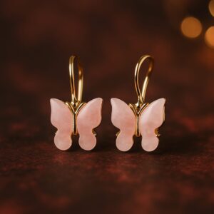 Artificial butterfly earrings with pink enamel finish and golden hooks by GlowingFusions.